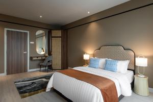 Postel nebo postele na pokoji v ubytování AMI Suites - Arte Mont Kiara