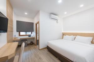 Chiangkhan River Walk Hotel客房内的一张或多张床位