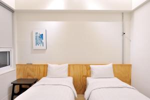 Postel nebo postele na pokoji v ubytování Home Rest Hotel 2