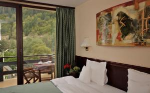 Postel nebo postele na pokoji v ubytování Zan Hotel + 33 fotografií