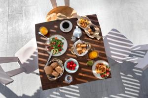 an overhead view of a table with food on it at Santa Irina Luxury Sunny Lofts in Perivolos