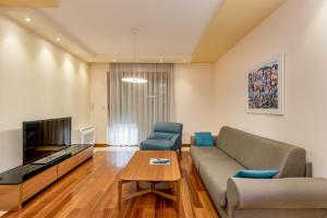TV a/nebo společenská místnost v ubytování Apartments Athos