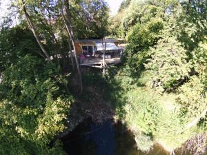 an aerial view of a house in the middle of a river at Ô Chalet in Beloeil