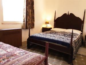 
A bed or beds in a room at Casa do Jardim
