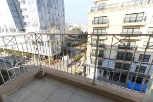 a balcony with a view of a city at AirTLV - Arlozorov Apartment's in Tel Aviv