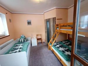 Postel nebo postele na pokoji v ubytování Apartmany Železná Ruda
