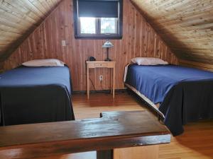 Postel nebo postele na pokoji v ubytování Chalets de l'Anse Ste Helene