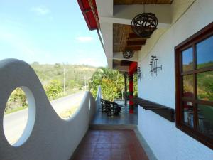 a hallway of a building with a view of a road at Hotel La Punta in Montañita