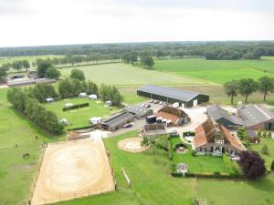 an aerial view of a farm with a barn at Glampingtent 't Haller Vorden in Vorden
