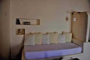 A bed or beds in a room at Pambelos Lodge