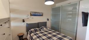 Posteľ alebo postele v izbe v ubytovaní Prato Smeraldo Apartment