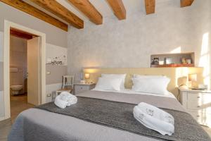 Säng eller sängar i ett rum på Il Nido dei Gufi Bed and Breakfast