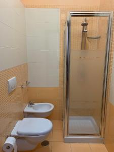 a bathroom with a shower and a toilet and a sink at Piazza del Popolo in San Pietro Vernotico +14 photos