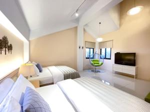 Un pat sau paturi într-o cameră la Annong White House +59 fotografii