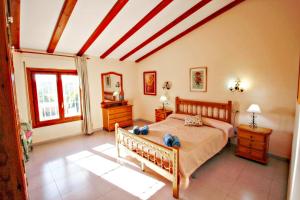 a bedroom with a bed in a room at Finca Palacios - comfortable holiday accommodation in Benissa in Benissa +26 photos