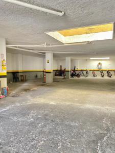an empty parking garage with motorcycles parked in it at Hotel Mansión Real in Bucaramanga
