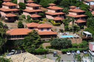 an aerial view of a house with a pool at Aguabúzios Hotel in Búzios