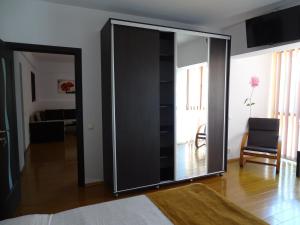 a large sliding glass door in a living room at Alpin Residence in Sinaia