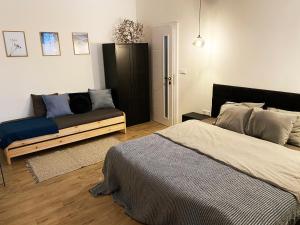 A bed or beds in a room at Apartmány Elli