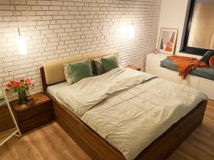 A bed or beds in a room at Apartmány Elli