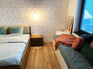 A bed or beds in a room at Apartmány Elli