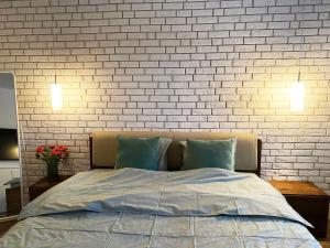 A bed or beds in a room at Apartmány Elli