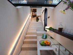 a staircase in a house with a bowl of fruit at vondice hotel in Amsterdam