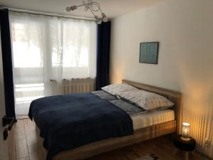 Posteľ alebo postele v izbe v ubytovaní Apartamencik - Kowary
