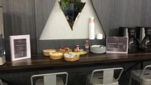 a counter with baskets of food on a table at Privada de Horacio 18 Residences in Mexico City