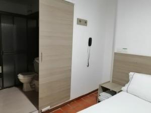 Postel nebo postele na pokoji v ubytování Hotel 42 Avenida