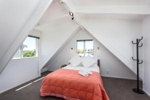 Säng eller sängar i ett rum på Sunset Sands Holiday Accomodation