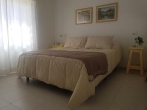a large bed in a bedroom with at Andoli 1 in Santa Rosa