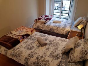 Un pat sau paturi într-o cameră la Fortune Guest house