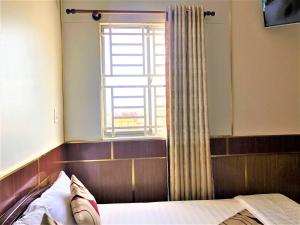 Postel nebo postele na pokoji v ubytování Hong Dao 2 Hotel