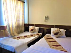 Postel nebo postele na pokoji v ubytování Hong Dao 2 Hotel