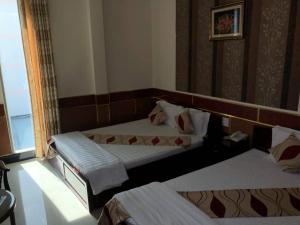 Postel nebo postele na pokoji v ubytování Hong Dao 2 Hotel