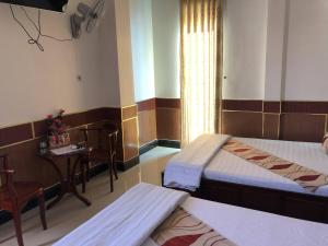 Postel nebo postele na pokoji v ubytování Hong Dao 2 Hotel