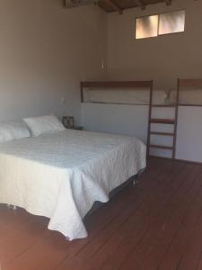 Postel nebo postele na pokoji v ubytování Origenes Spa & Lodging