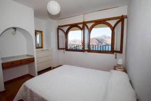 Postel nebo postele na pokoji v ubytování CasaMarga San José Precioso apartamento con piscina y vistas al mar + 11 fotografií