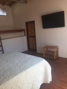 Postel nebo postele na pokoji v ubytování Origenes Spa & Lodging