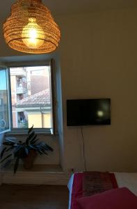 A television and/or entertainment centre at Vive Roma!