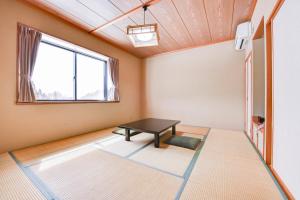 A bed or beds in a room at Kanoe