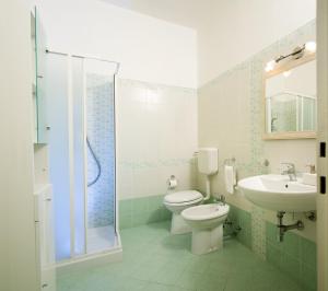 a bathroom with a toilet and a sink and a shower at Leccesalento Bed And Breakfast in Lecce