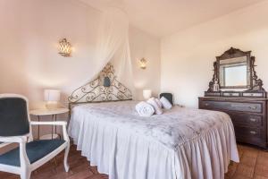 מיטה או מיטות בחדר ב-Casa da Ermida