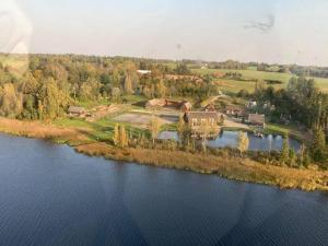 an aerial view of a lake and a farm at Sammuli Holiday Village in Viljandi