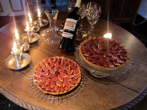 two plates of cookies on a table with candles at Auberge des Deux Rivières in Seix