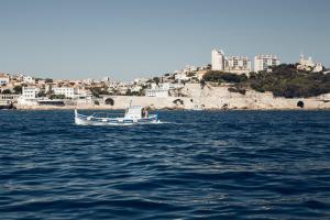 a small boat in a body of water at ibis Styles Marseille Centre Prado Place Castellane in Marseille