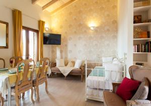 a living room with a table and a couch at Rafaello Luxury Villa in Agia Pelagia