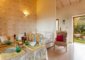 a dining room with a table and chairs at Rafaello Luxury Villa in Agia Pelagia