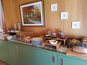 a kitchen with a buffet with food on it at Unterbergerhof in Val di Vizze